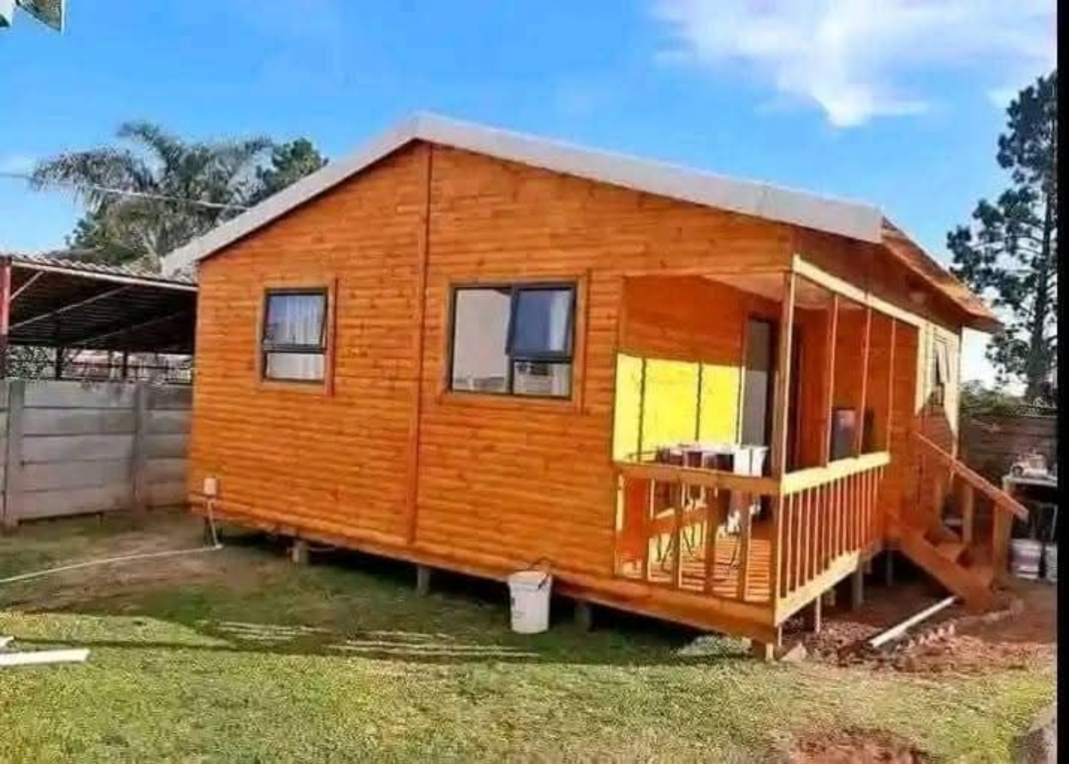 Wooden log cabin with veranda